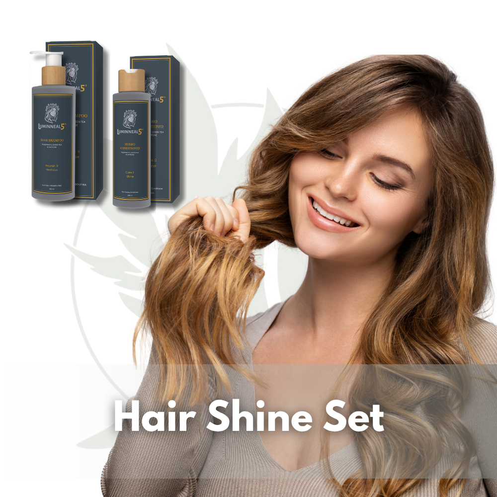 Woman with styled hair holding a section, with two bottles of hair care products on a white background. (Luminneal5 hair Shine Set)